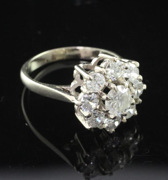 An 18ct white gold and diamond cluster ring, size N.
